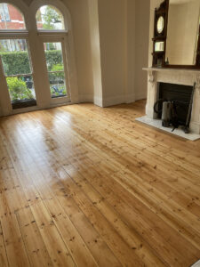 Traditional pine timber floor with arched windows