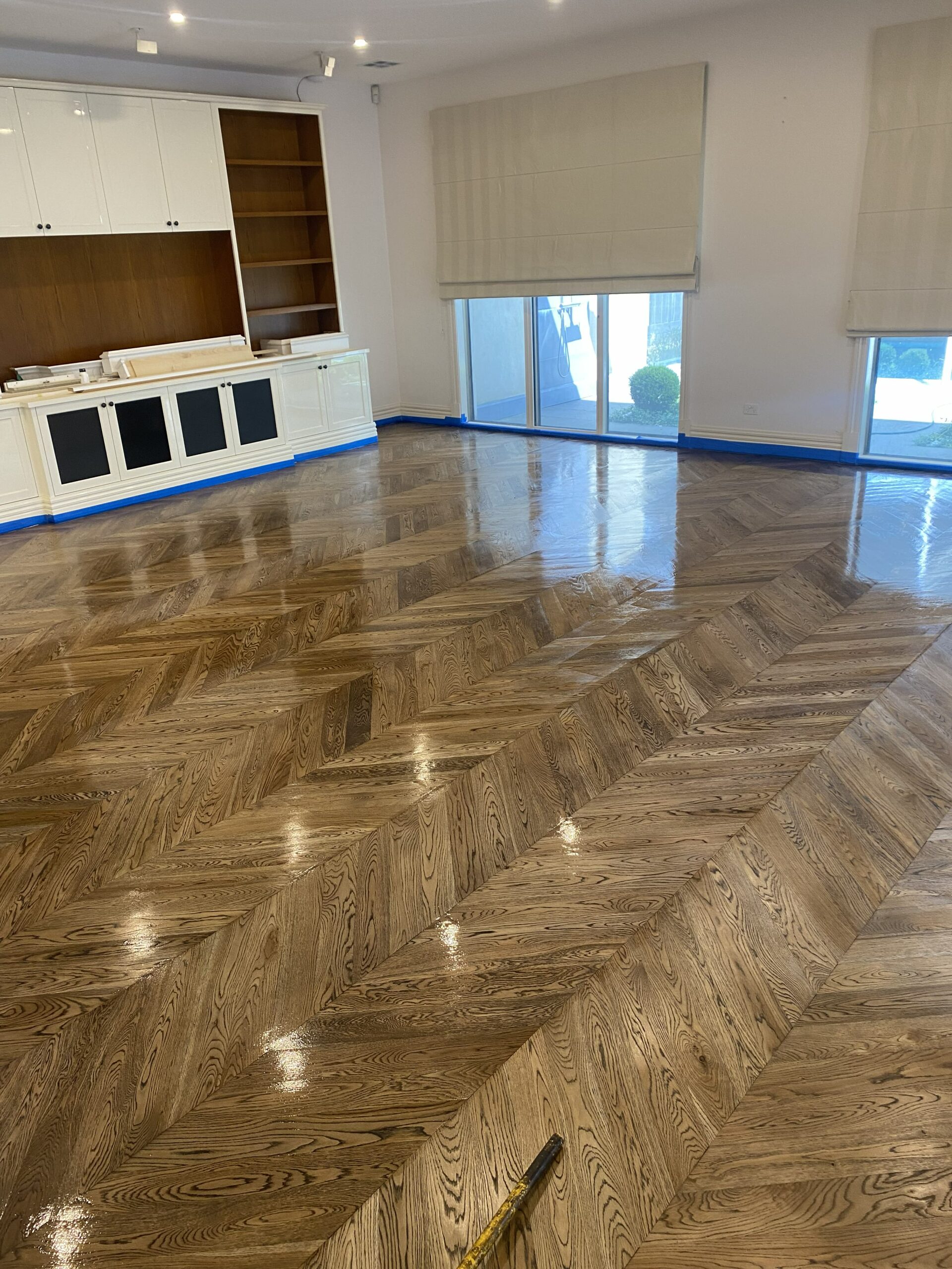 Oak chevron parquetry flooring across an open-plan living area